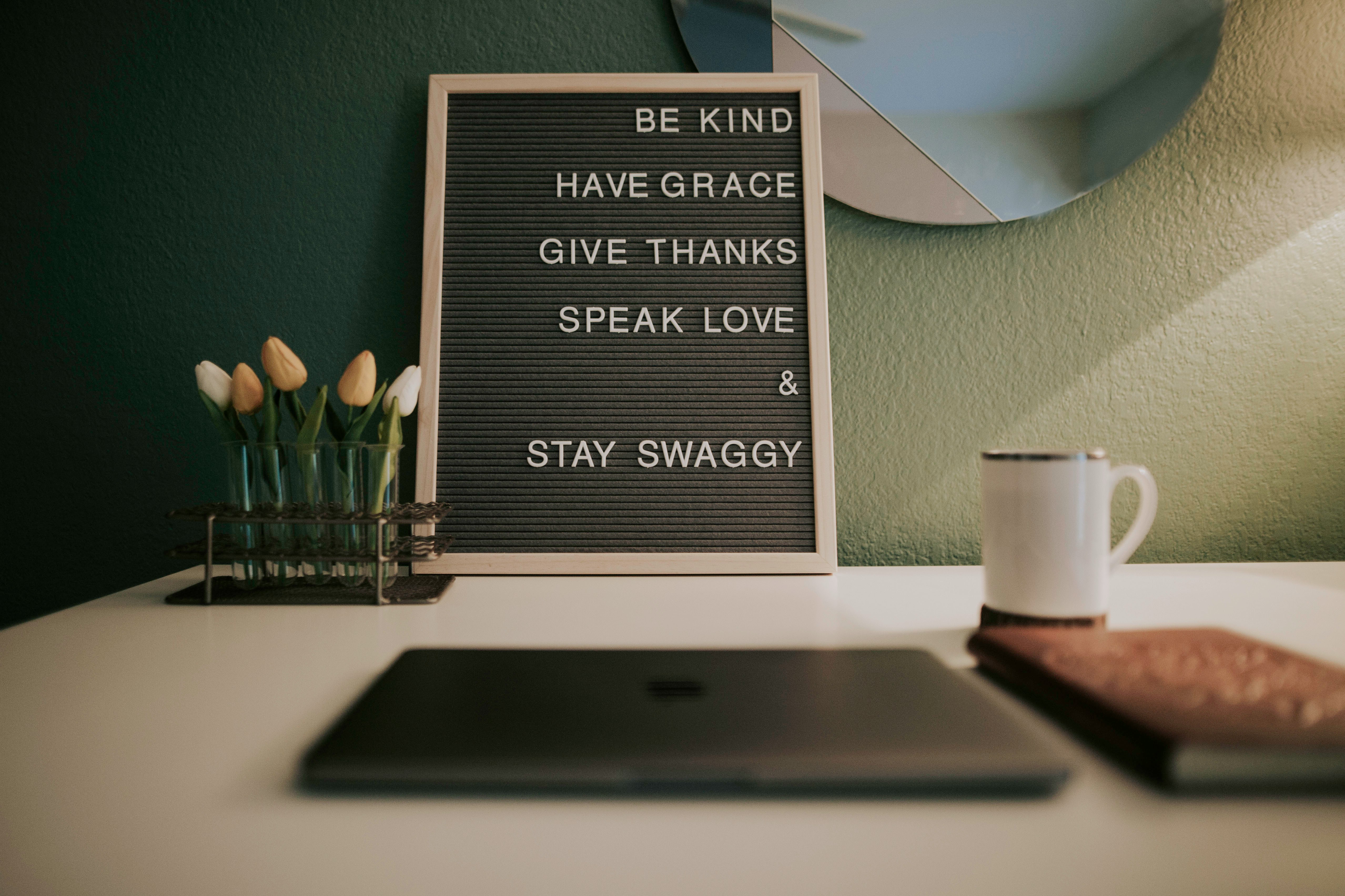 Peaceful, organized workspace with inspirational message